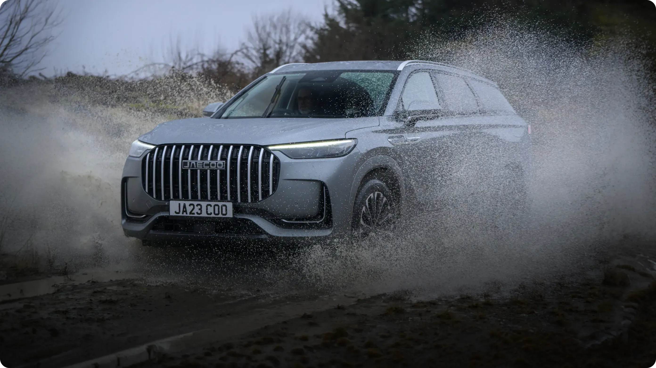 JAECOO vehicle driving through water