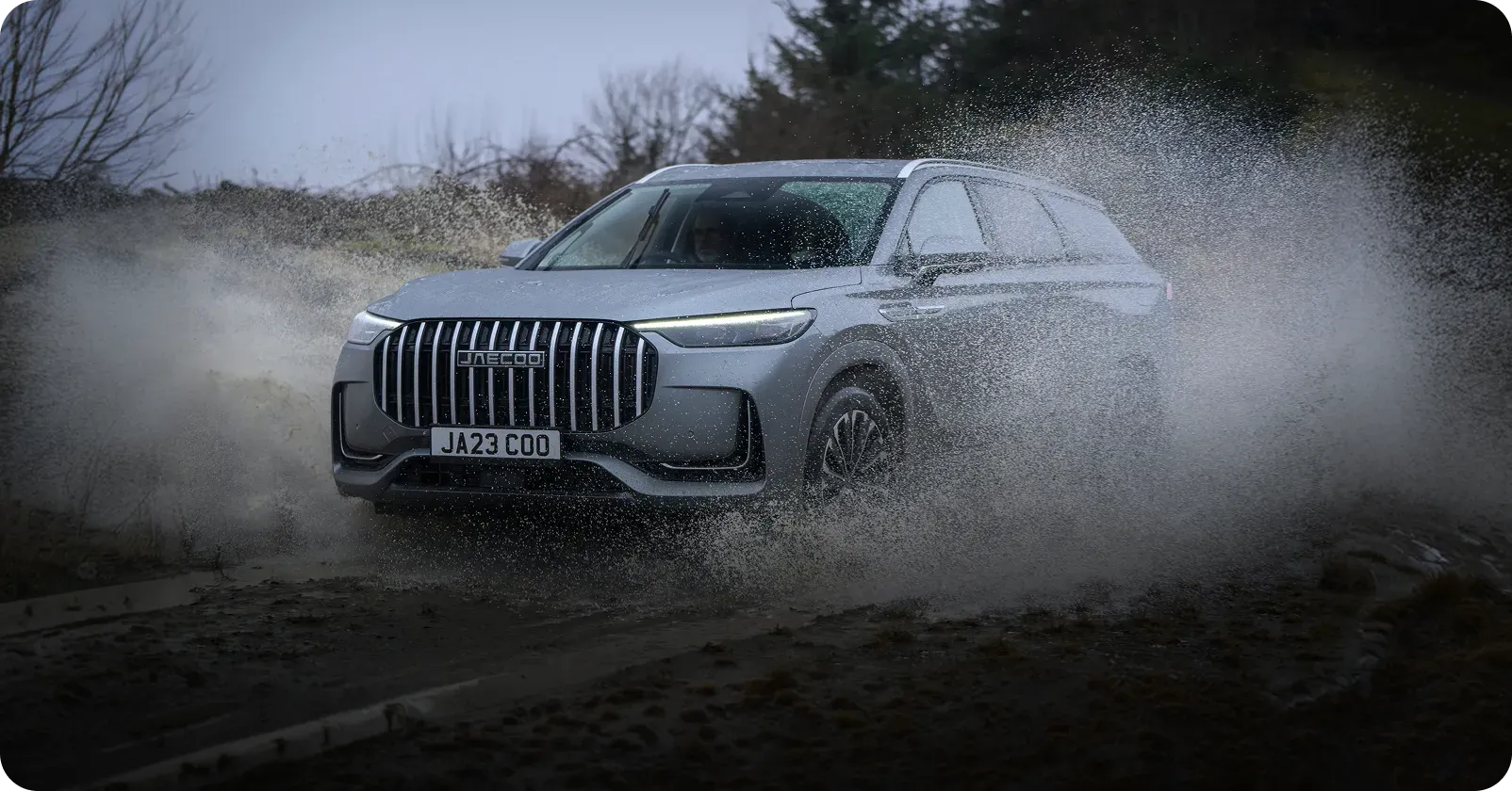 JAECOO vehicle driving through water